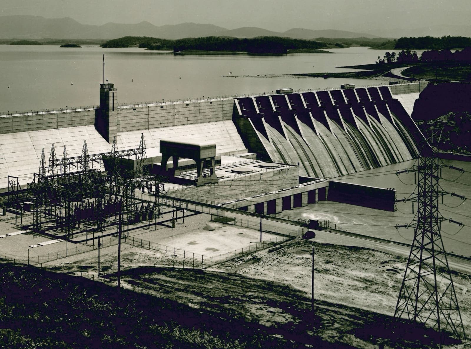 A hydroelectric dam and its switchyard under load